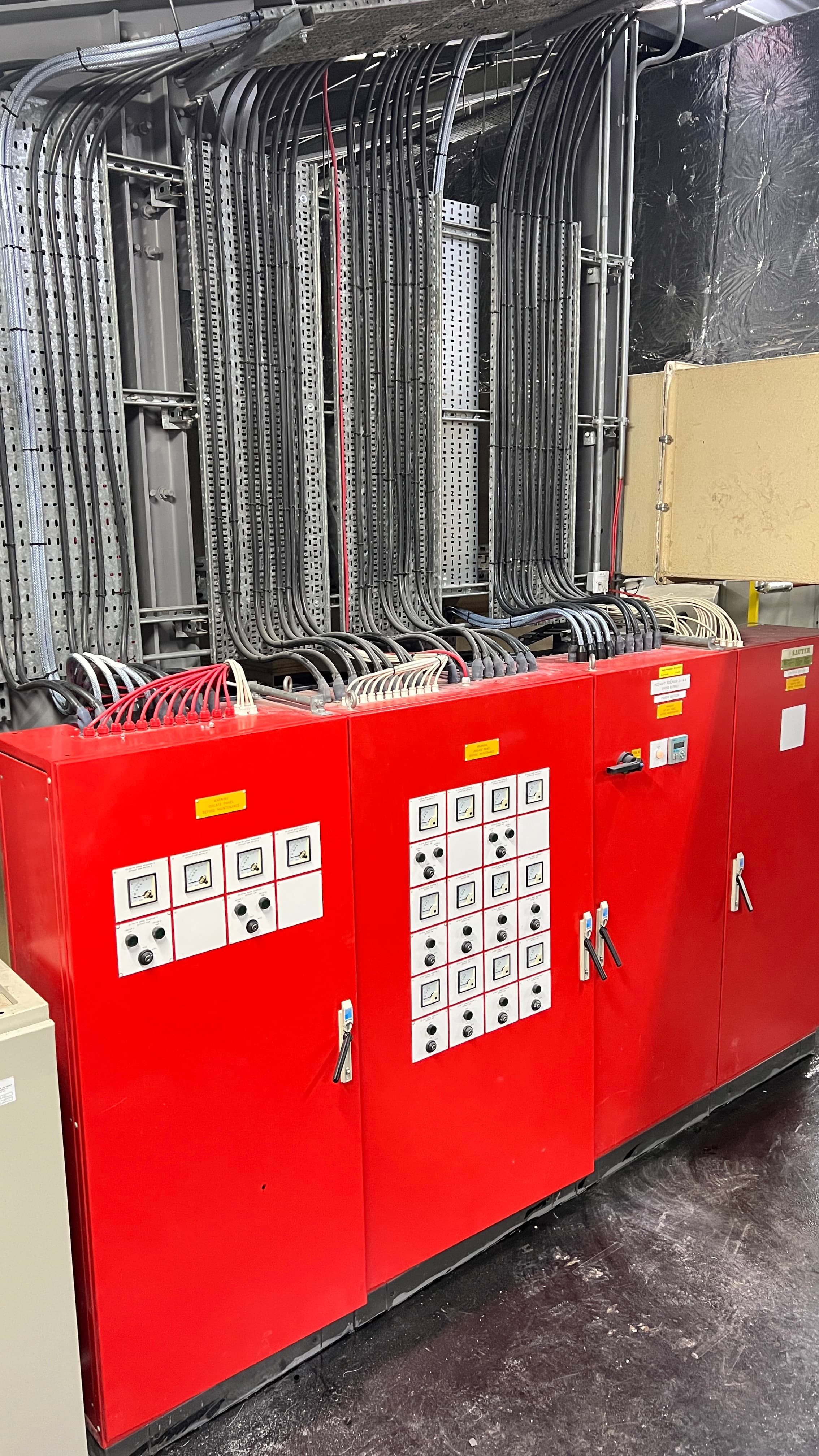 Red control panels with extensive cable management