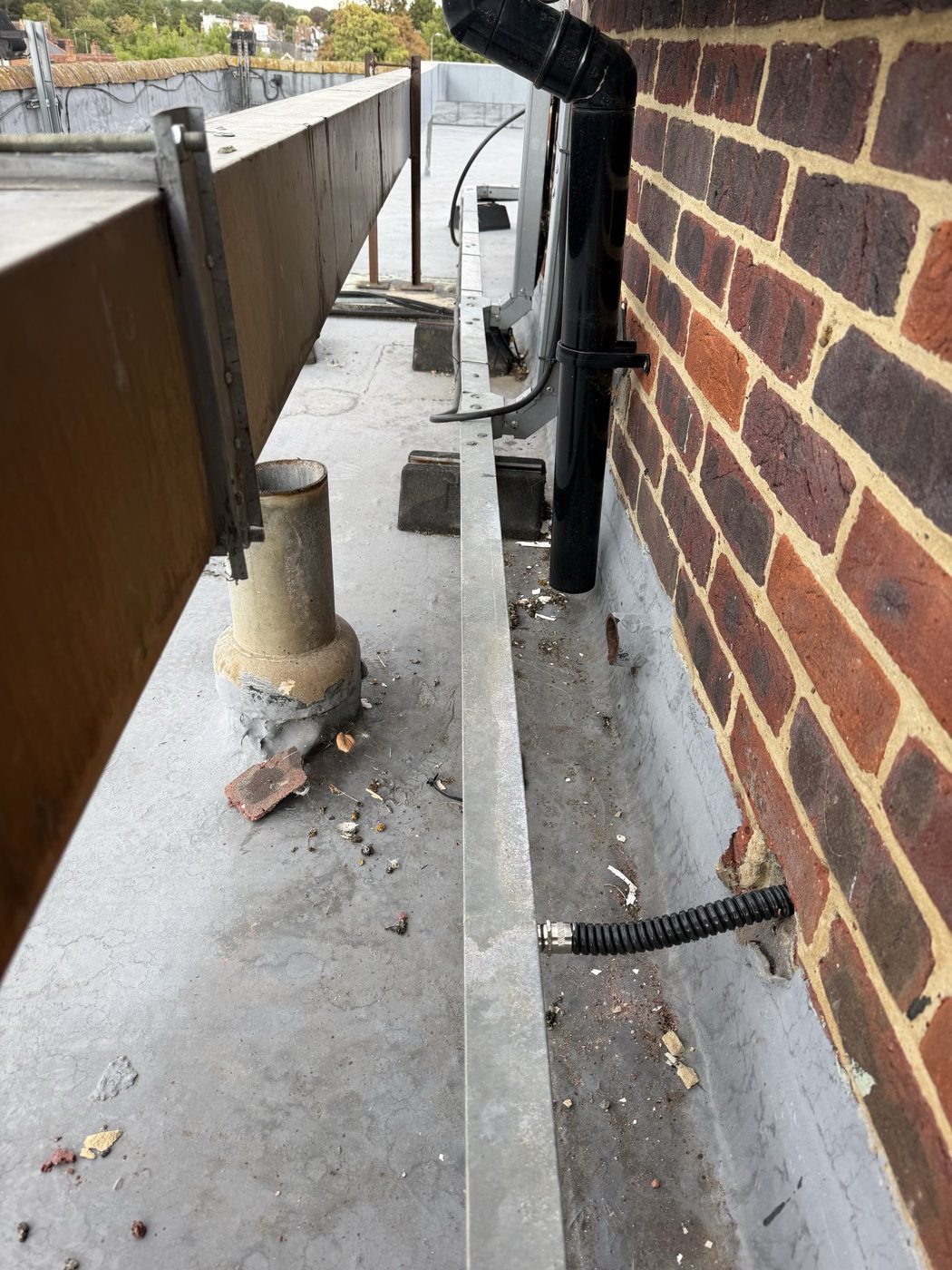 Kopex through an existing roof penetration into rooftop trunking carrying tank level sensor cabling