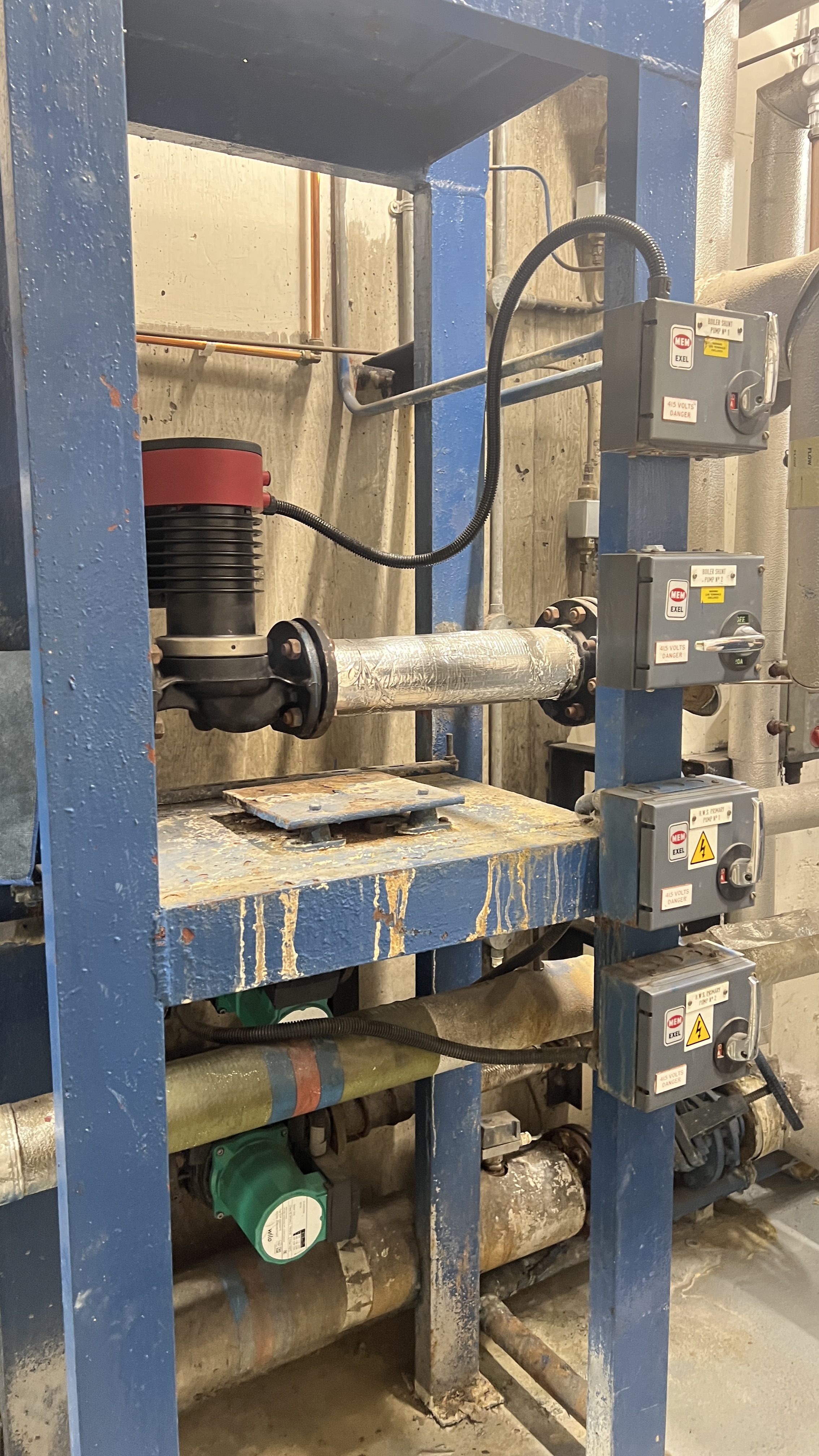 Blue painted pump assembly with pressure sensors and vibration isolators