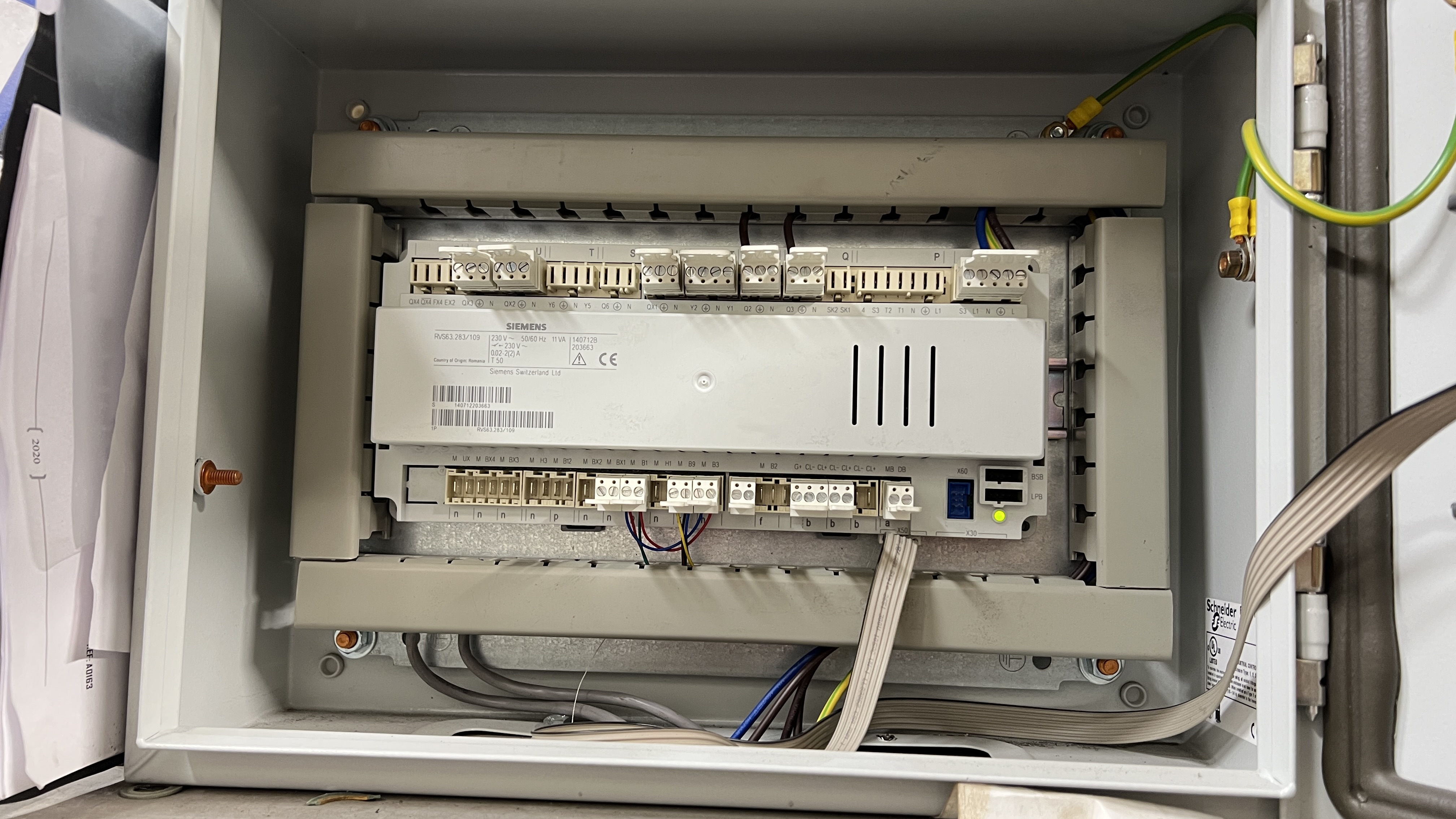 Siemens RVD110 controller panel interior showing terminal strips