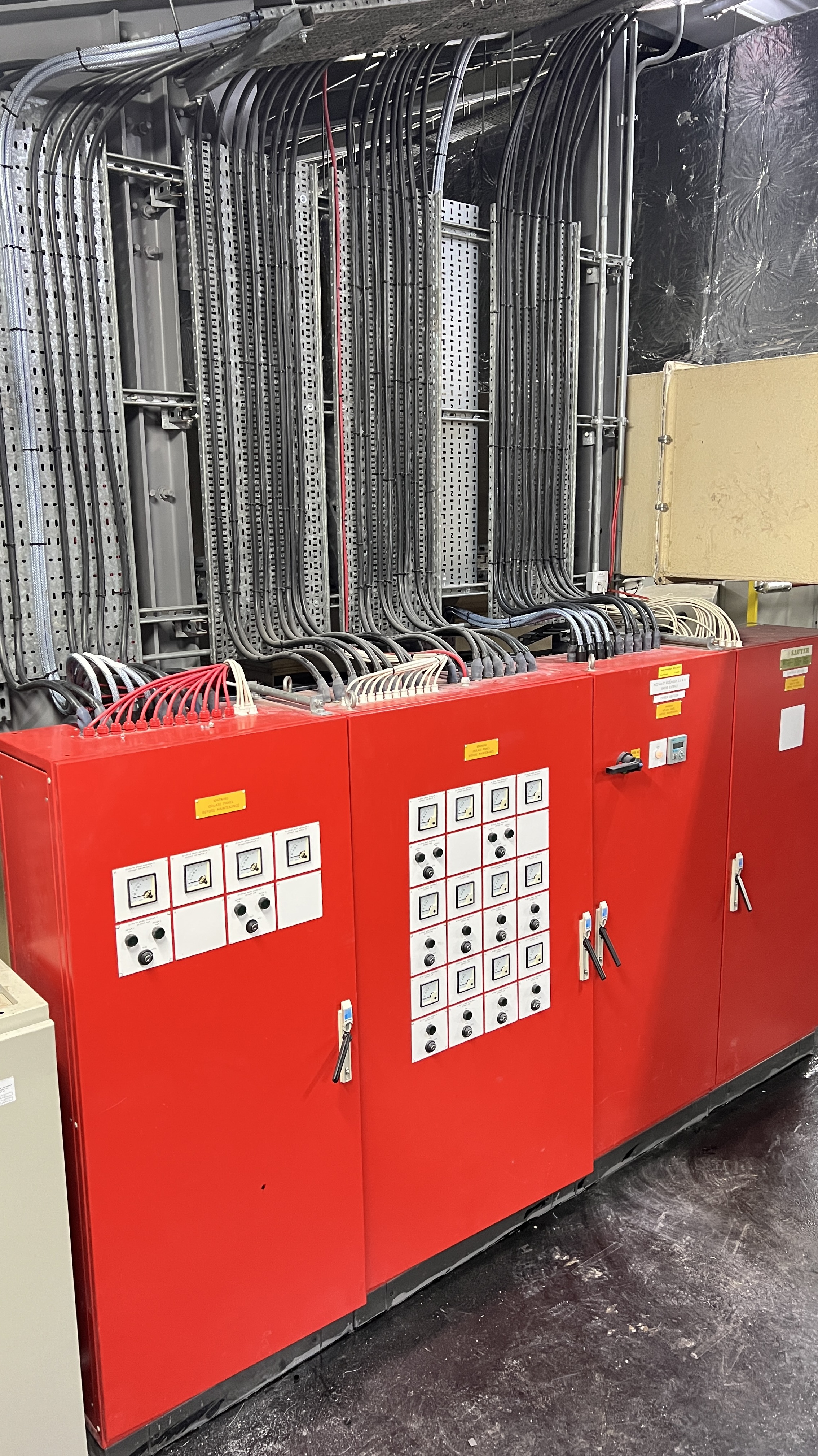 Red control panels with extensive cable management