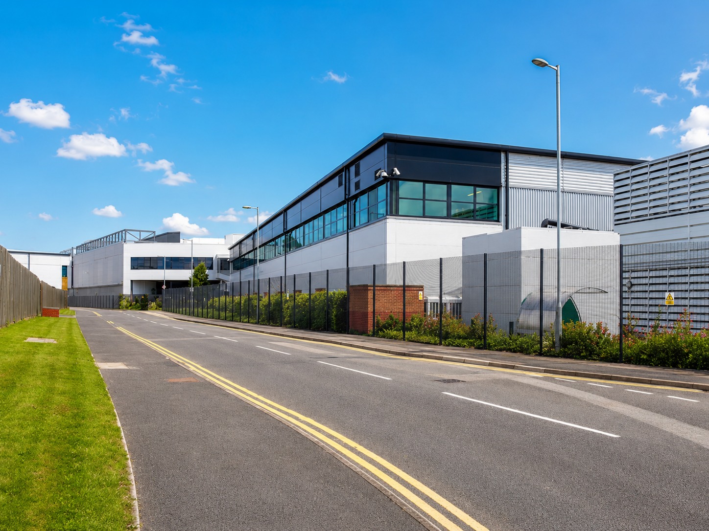 BMS vs DCIM vs EPMS — exterior of a live data centre in Park Royal, London, where Alpha Controls upgraded the cooling-tower controls